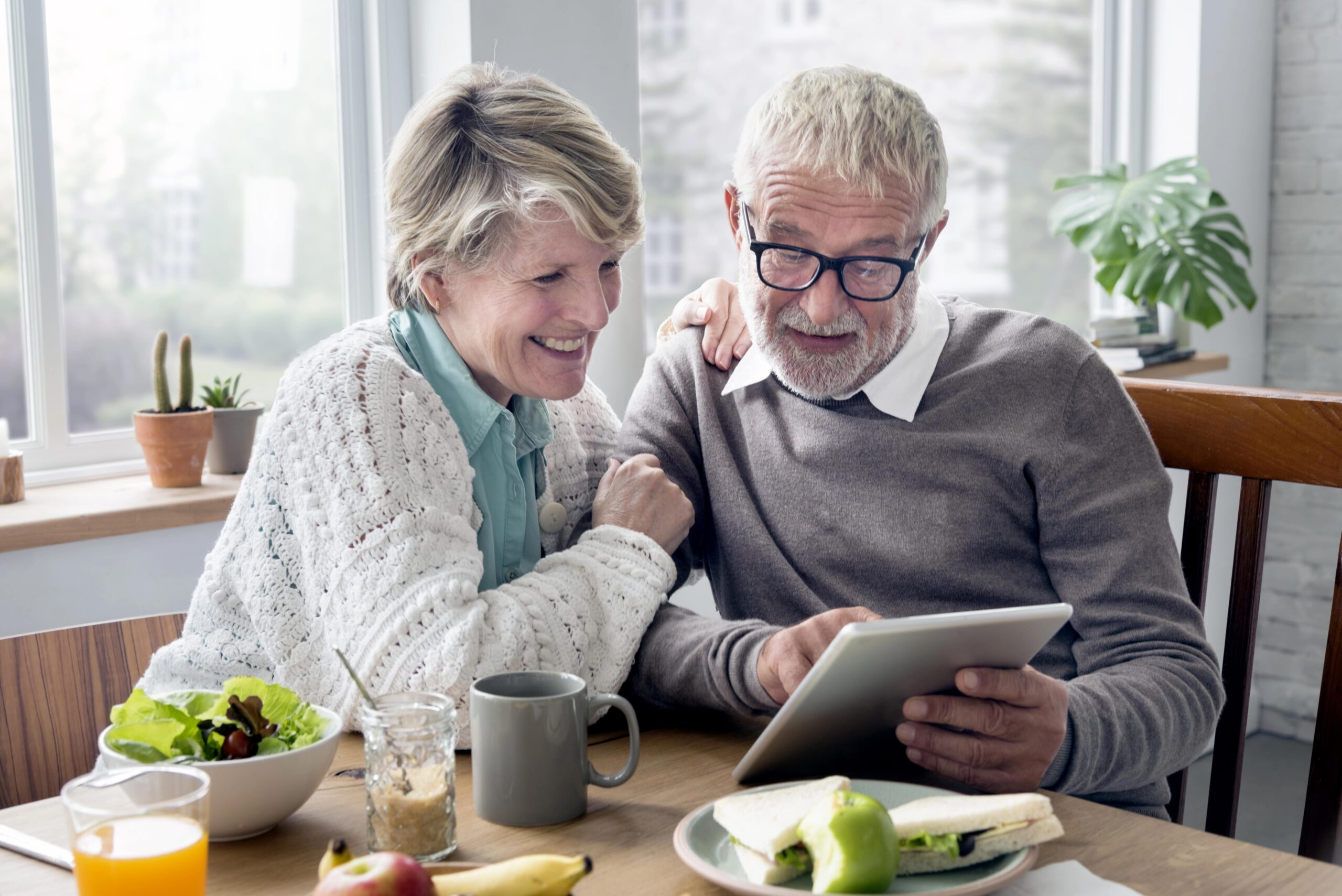 Senior couple looking at tablet together